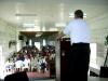 Brother Ken Yates preaching to a congregation in Georgetown